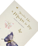 UK Greetings "You're Like a Mum to Me" birthday card with floral design, celebrating mothers on a heartfelt birthday occasion.