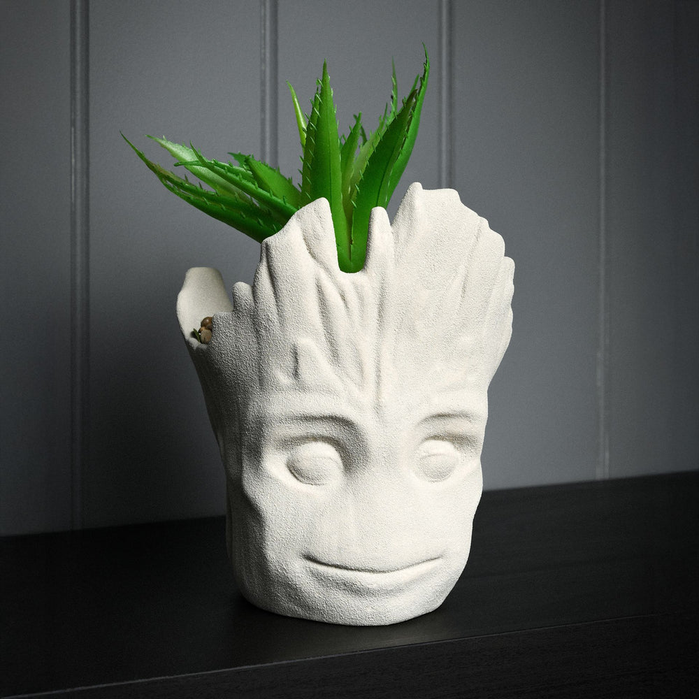 Marvel Groot planter with faux green plant, featuring detailed Groot character from Marvel comics, perfect for home decor.