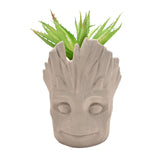 Marvel Groot planter with faux green plant, featuring detailed Groot character in a ceramic pot.