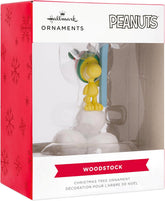 Hallmark Woodstock Peanuts resin Christmas ornament hanging on a decorated tree.