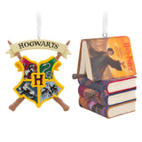 Hallmark Harry Potter Christmas ornaments featuring Hogwarts crest and stacked books with wand, set of 2.
