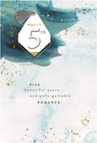 Hallmark 5th wedding anniversary greeting card with a 3D tag design, featuring elegant decorative elements and heartfelt message.