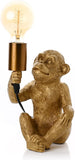 Hestia monkey novelty lamp with a warm bulb, 25cm tall, stylish home decor piece featuring a playful monkey design.