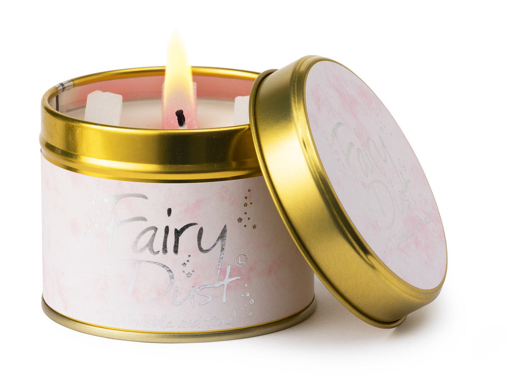 Lily-Flame Fairy Dust scented tin candle with decorative label and closed lid, ideal for adding a magical touch to your space