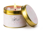 Lily-Flame Fairy Dust scented tin candle with decorative label and closed lid, ideal for adding a magical touch to your space