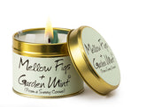 Lily-Flame scented tin candle with mellow figs and garden mint fragrance, featuring a decorative label and compact metal container.