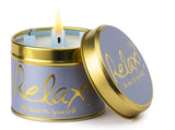 Lily-Flame Relax scented tin candle with a decorative label, designed for creating a calming ambiance.