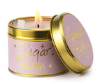 Lily-Flame Sugar Rush scented tin candle with colorful packaging and a lit wick, perfect for home fragrance.