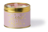 Lily-Flame Sugar Rush scented tin candle with a colorful, decorative label and a lit wick, designed for home fragrance.