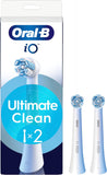 Two white Oral-B iO Ultimate Clean replacement brush heads for electric toothbrushes, shown with bristles in the image.
