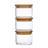 Set of three Sass & Belle stacking glass storage jars for kitchen organization with clear, labeled containers.