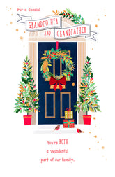 UK Greetings Christmas card featuring a blue door with a wreath, designed for Grandmother and Grandfather.