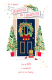UK Greetings Christmas card featuring a blue door with a wreath, designed for Grandmother and Grandfather.