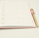 Tallon A5 pink hardback Z address book with alphabet tabs and a matching pen, ideal for organizing contacts and stationery use.