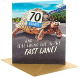 UK Greetings 70th birthday card featuring a funny tortoise design with an envelope, suitable for her or him.