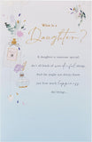 UK Greetings birthday card for daughter titled "What Is a Daughter?" featuring colorful floral illustrations and heartfelt message.