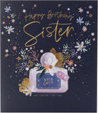 UK Greetings birthday card for sister featuring a floral perfume design with colorful, elegant floral artwork.