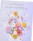 UK Greetings Meadows birthday card featuring elegant nature design, suitable for all ages, with colorful floral and outdoor imagery.