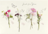 Set of six UK Greetings floral birthday cards featuring pretty, colorful floral designs for celebrating special occasions.