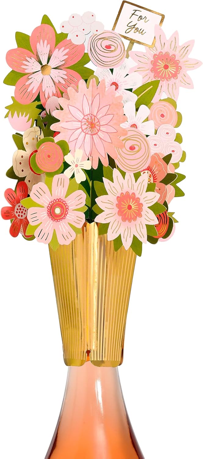 UK Greetings floral bottle topper, decorative bottle stopper accessory with vibrant floral design for wine or beverage bottles.