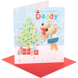 UK Greetings Boofle Christmas card featuring a festive scene near a Christmas tree, designed for celebrating Christmas with loved ones.