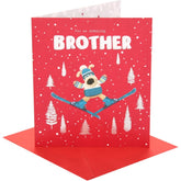 UK Greetings Boofle skiing brother Christmas card featuring festive holiday illustration with cheerful design and seasonal greetings.