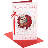 UK Greetings Christmas card featuring Boofles in a festive wreath for Mum and Dad, with colorful holiday illustrations.