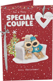 UK Greetings Boofles sitting on couch Christmas card featuring a cute cartoon couple, perfect for holiday greetings.