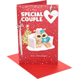 UK Greetings Boofles sitting on couch Christmas card featuring a cute couple design for the holiday season.
