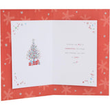 UK Greetings Christmas card featuring Boofles sitting on a log, part of the All of Us holiday greeting card collection.
