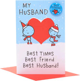 UK Greetings Christmas card for husband featuring a "Best Husband" badge design with festive holiday imagery.