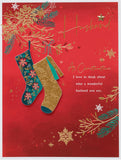 UK Greetings Christmas card for husband featuring a deep red and gold festive design, perfect for holiday greetings.