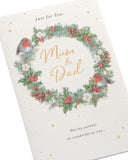 UK Greetings Christmas greeting card for Mum and Dad featuring a festive wreath design and holiday-themed artwork.