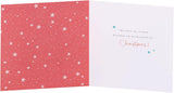 UK Greetings Christmas greeting card featuring adorable penguins ice skating, designed for sister and brother-in-law.