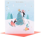 UK Greetings Christmas greeting card for grandmother featuring a festive multi-caption design with holiday-themed illustrations.