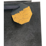 UK Greetings black design large gift bag, durable gift bag with stylish black pattern, ideal for special occasions.