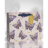 Large pink, purple, and gold butterfly design gift bag by UK Greetings, featuring elegant floral and butterfly patterns.