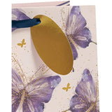 Pink, purple, and gold butterfly design large gift bag by UK Greetings with handles, ideal for special gift packaging.