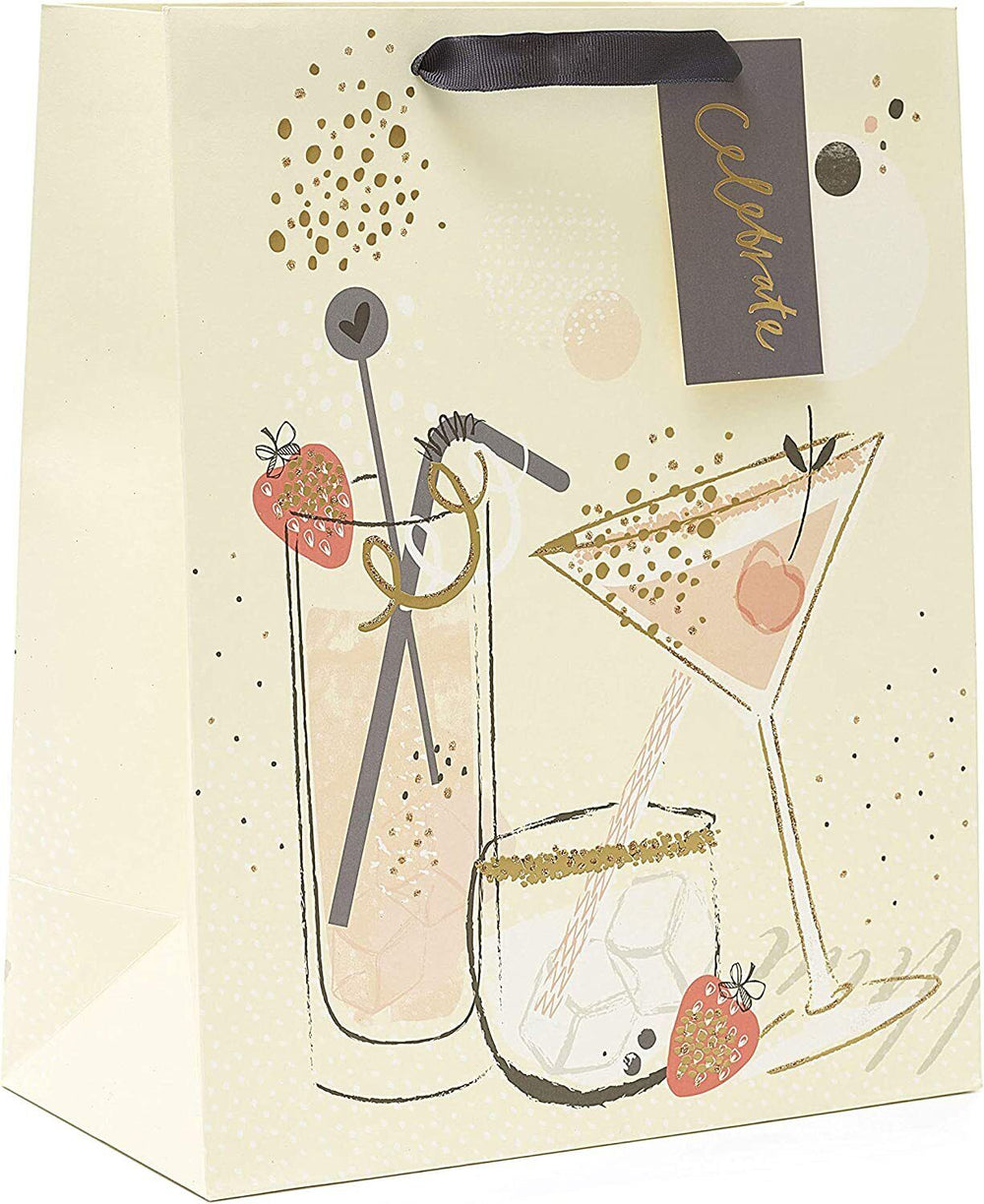 Large UK Greetings cocktail design gift bag with colorful drink illustrations, ideal for gift wrapping and presentation.