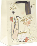 Large UK Greetings cocktail design gift bag with colorful drink illustrations, ideal for gift wrapping and presentation.