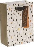 UK Greetings contemporary pattern gift bag with colorful floral and geometric designs, perfect for wrapping presents.