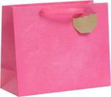 Bright pink UK Greetings large gift bag with handles, perfect for wrapping special presents or party favors.