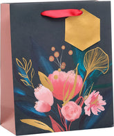 UK Greetings medium floral gift bag for women, featuring a colorful floral design, ideal for special occasions.