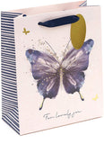 UK Greetings pink and purple butterfly design medium gift bag with handles, featuring floral accents and decorative patterns.