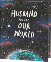 UK Greetings Father's Day card for husband featuring Our World design with heartfelt message and colorful artwork.