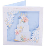 UK Greetings wedding greeting card with 3D cake design, featuring a festive and elegant appearance for special occasions.