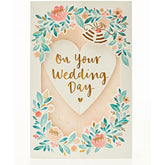 UK Greetings 3D pop-up floral wedding card showcasing a vibrant floral design and intricate wedding-themed pop-up elements.