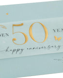 UK Greetings 50th wedding anniversary card with leaves design, suitable for him, her, or a friend, featuring elegant floral artwork.