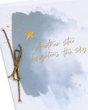 UK Greetings sympathy greeting card featuring a gold foil star and bright sky design, conveying heartfelt condolences.