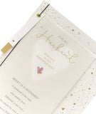UK Greetings anniversary greeting card for husband featuring a beautiful design and sentimental message for special occasions.